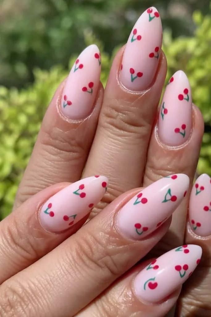 Cherry accent glossy blush nails.