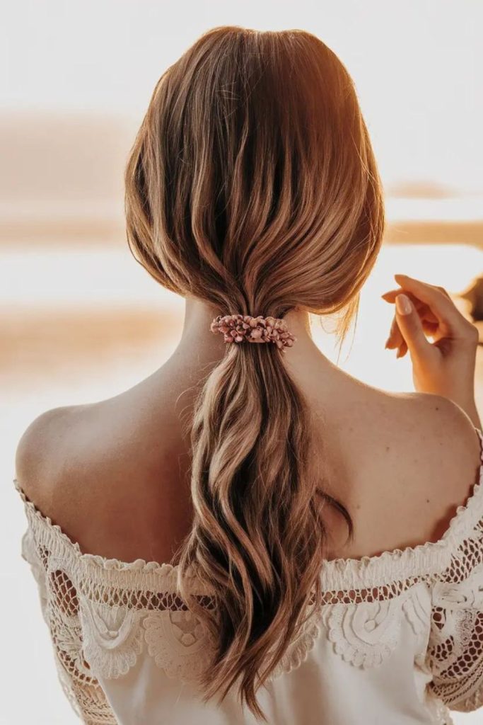 Chestnut low ponytail smooth relaxed finish