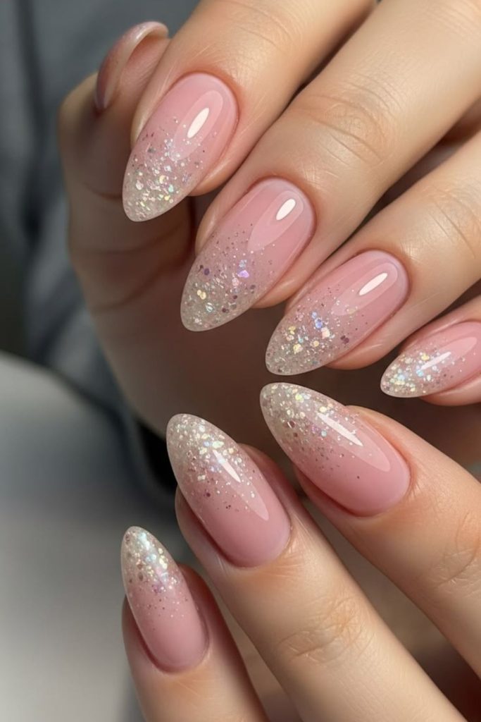 Nude crystal graduation nails with sparkle.