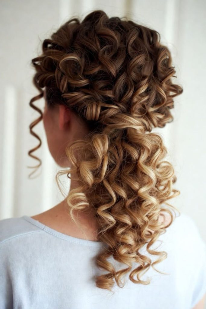 Diamond accented formal curly updo.