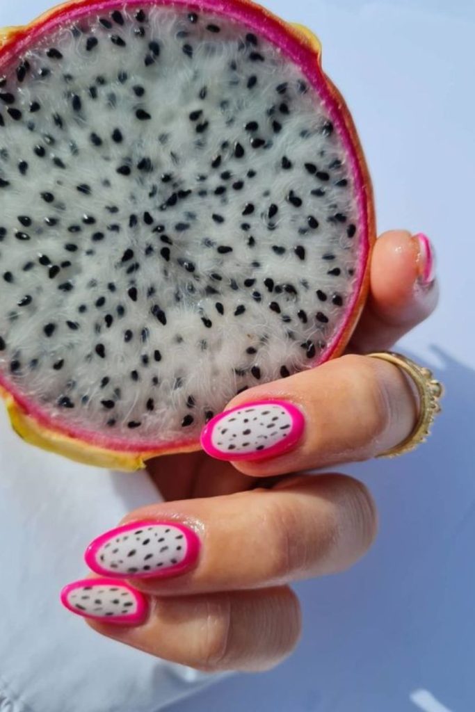 Dragon fruit vibrant nail design.