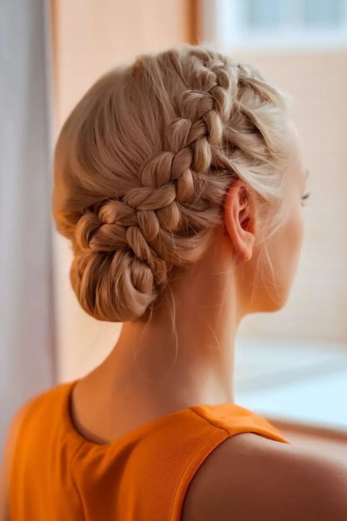 Low braided rustic bun look