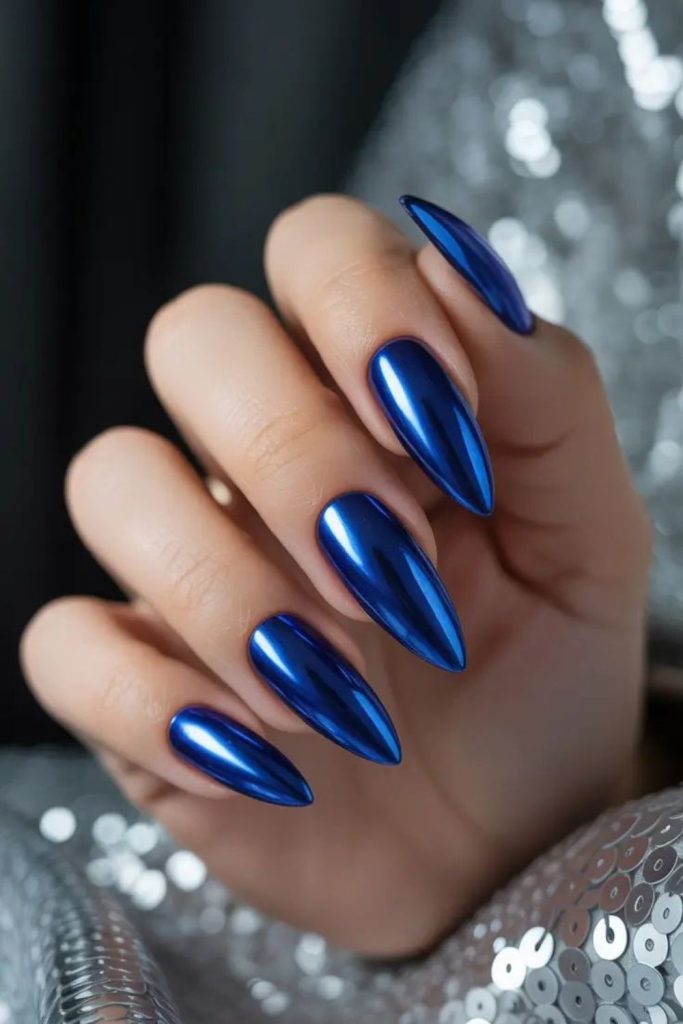 Sapphire blue chrome glam nails.