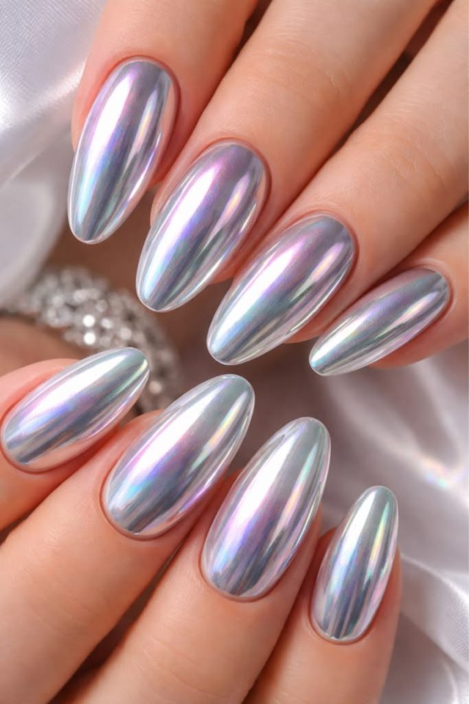 Silver holographic graduation nails with chrome.