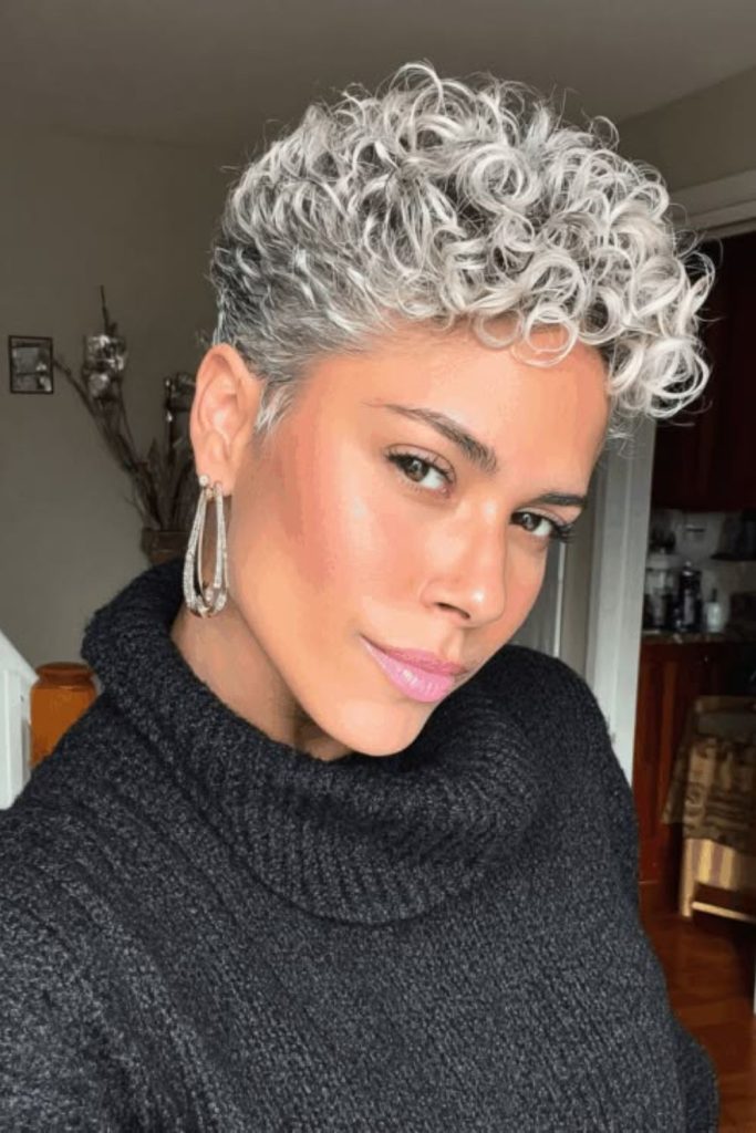 Cool green tinted pixie cut with soft texture and icy botanical vibe.