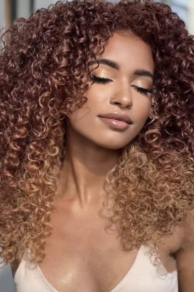Golden brown crochet curls natural glow.