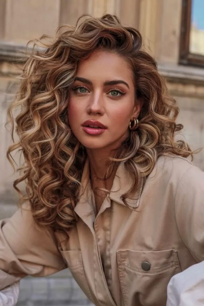 Golden drifting curls with bounce.