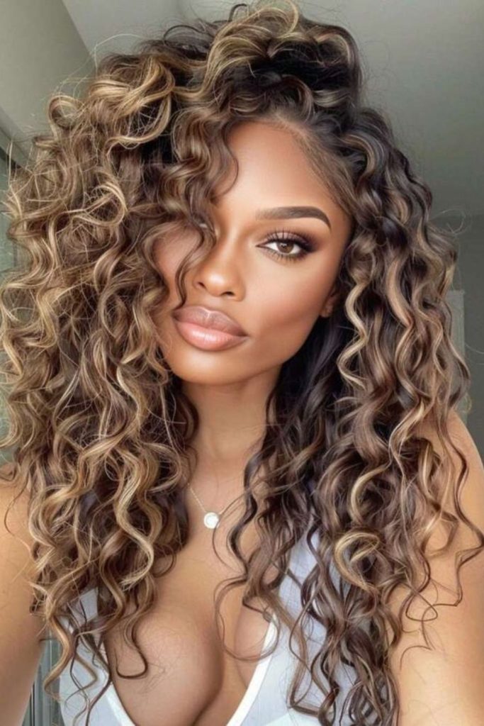 Golden highlight curls bright dimensional textured style