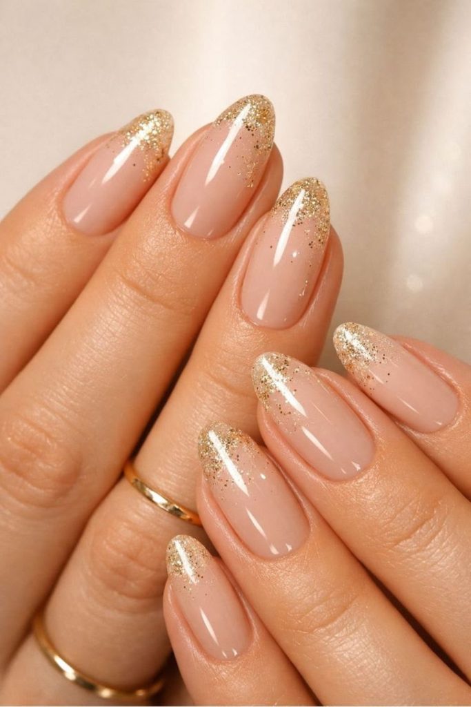 Nude gold chrome graduation nail design.