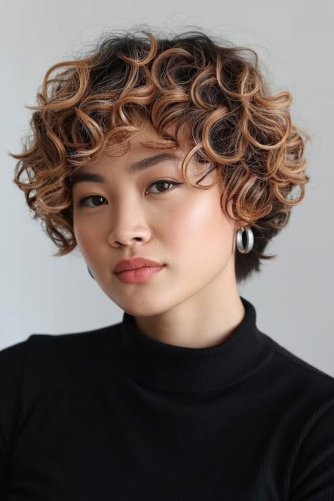 Honey toned blooming curly pixie cut