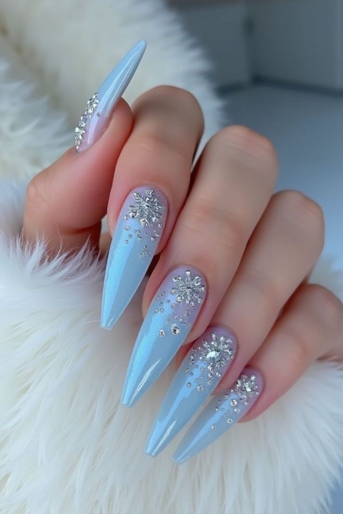 Frosted white stiletto glam nails.