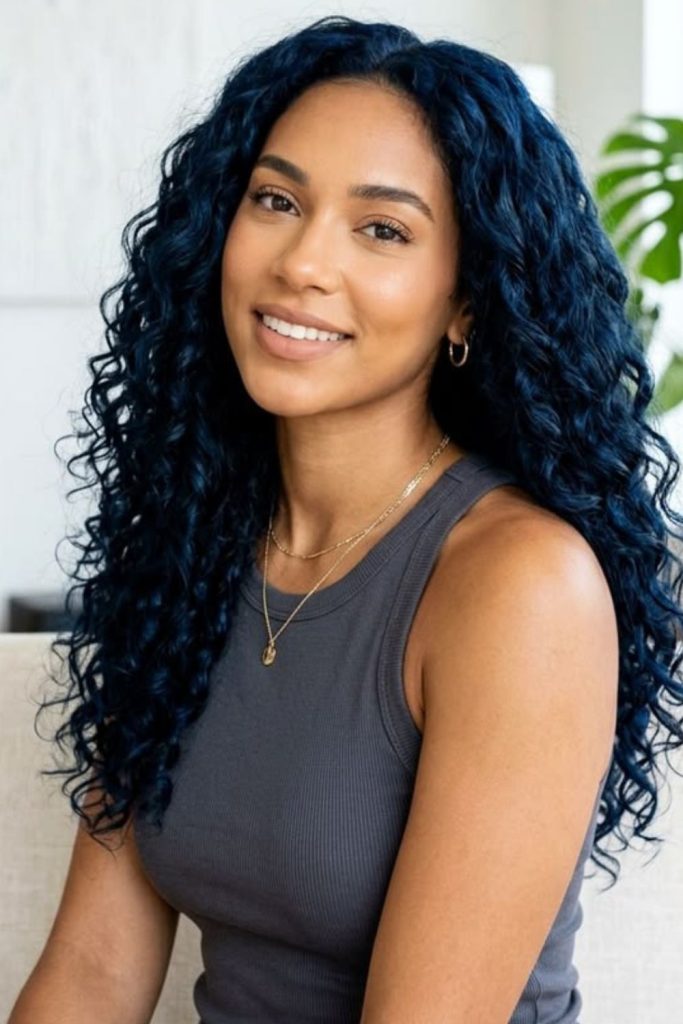 Deep colored flowing curls with moody artistic movement.