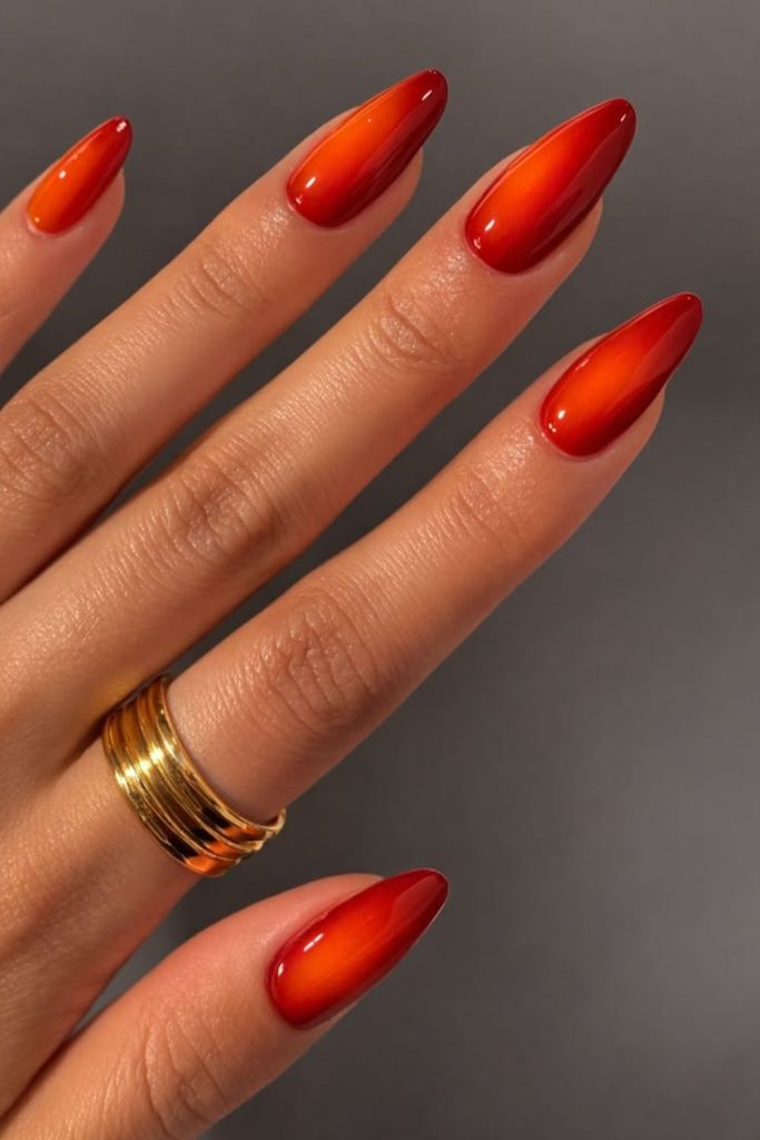 Molten red orange chrome nails