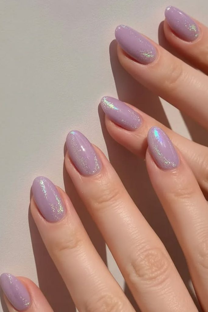 Lavender shimmer graduation nails with florals.
