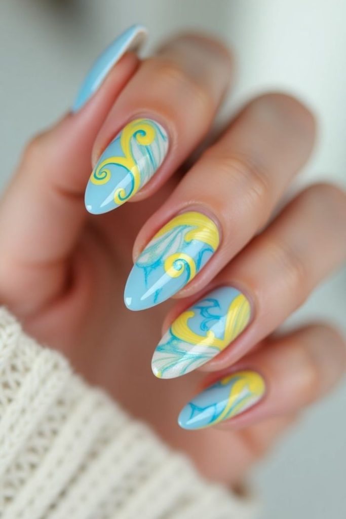 Aqua blue nails with yellow ripple effect.