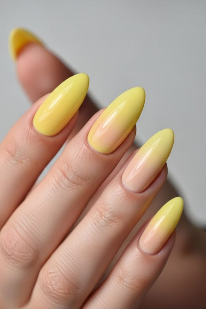 Glowing lemon aura nails with radiant soft light ethereal citrus beauty effect.