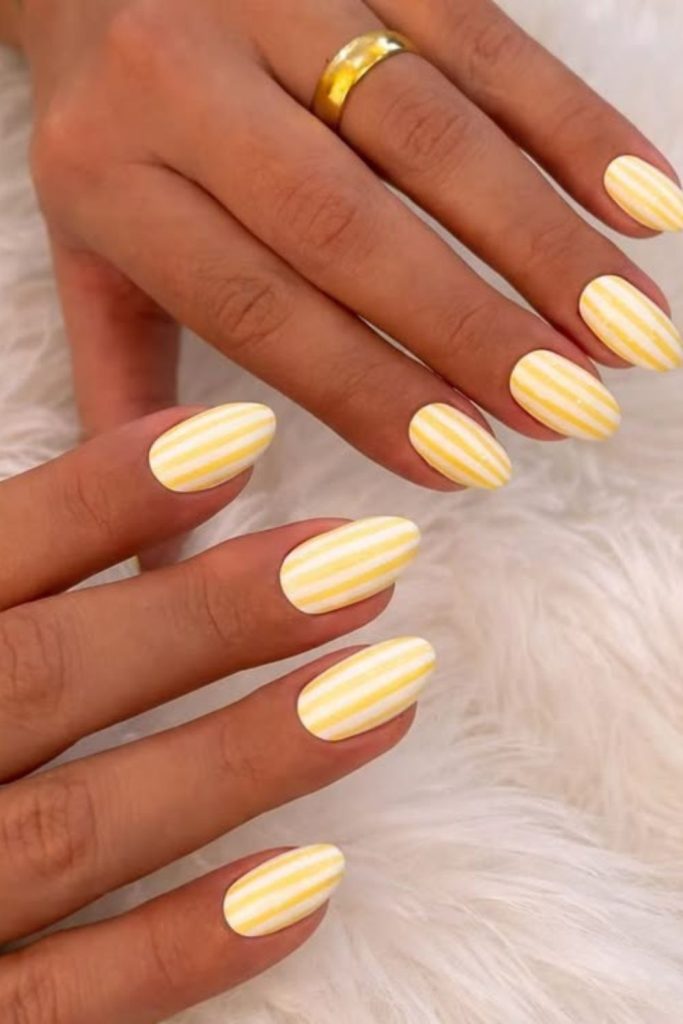 Candy stripe lemon nails with retro sweet pastel lined playful summer style.