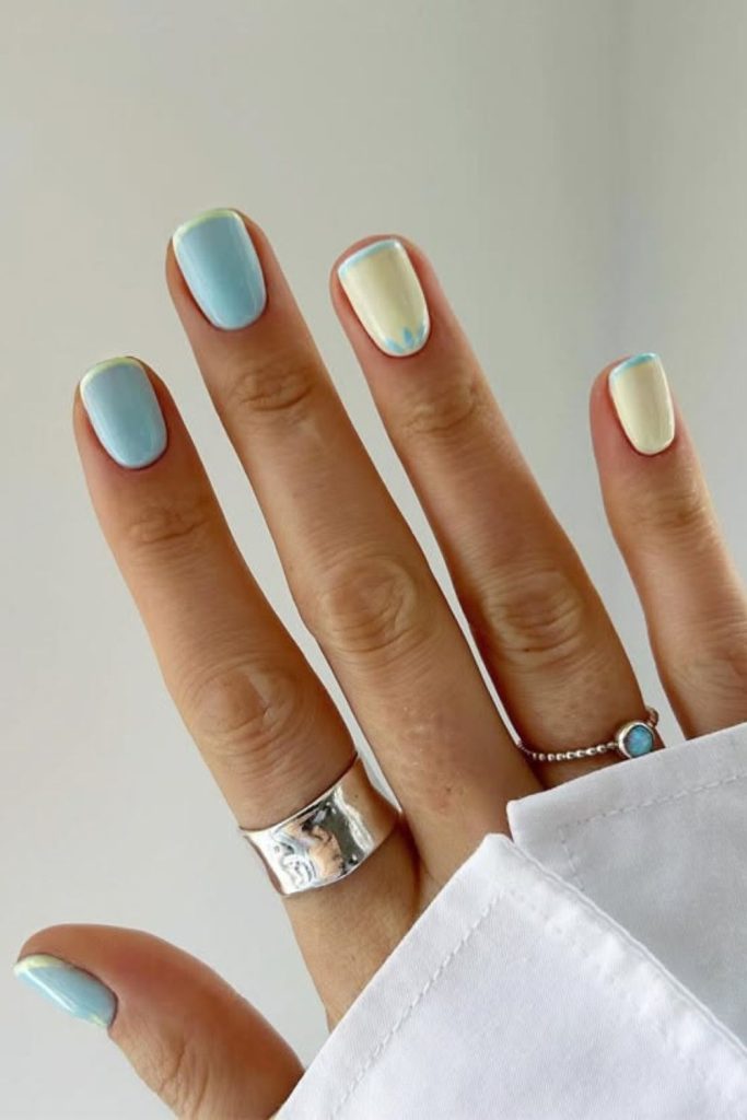 Pastel blue nails with yellow cloud drift.