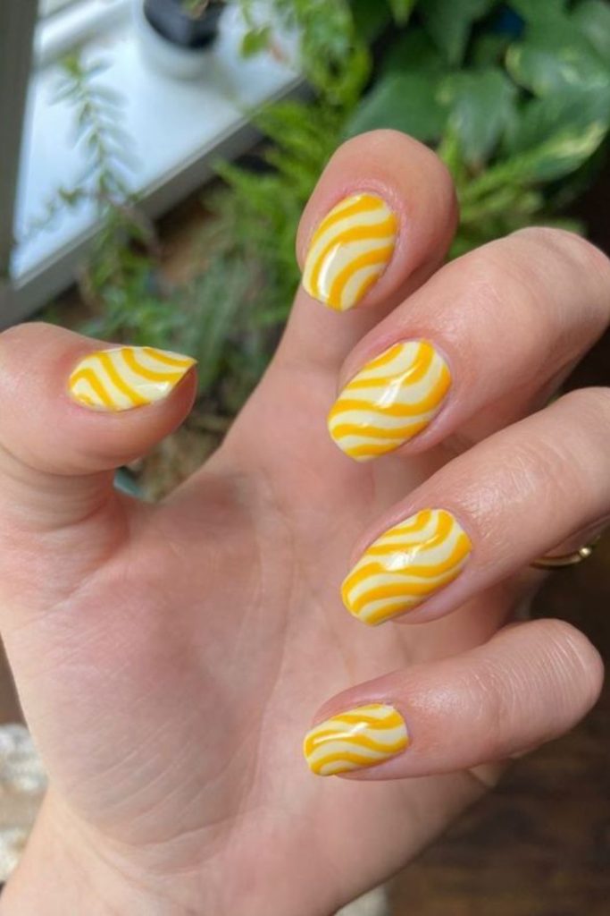Heatwave lemon nails with wavy warm glow intense summer fiery aesthetic vibe.