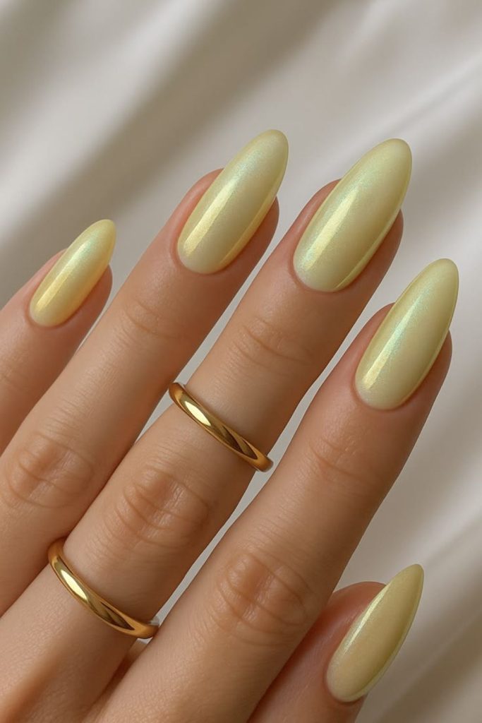 Sweet lemon nails with sugar sprinkle texture soft candy inspired manicure look.