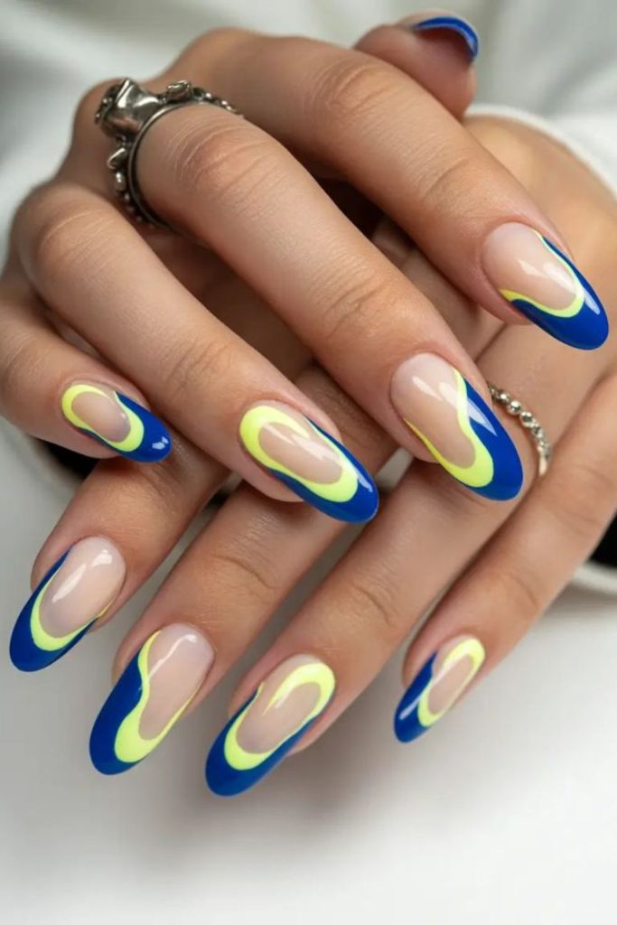 Blue nails with neon yellow edge outline.
