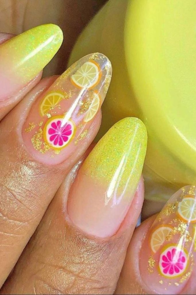 Lemon slice glossy yellow nails.