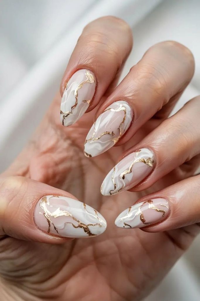 White marble nails with gold.