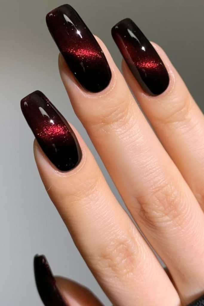 Midnight garnet drip luxe nail design