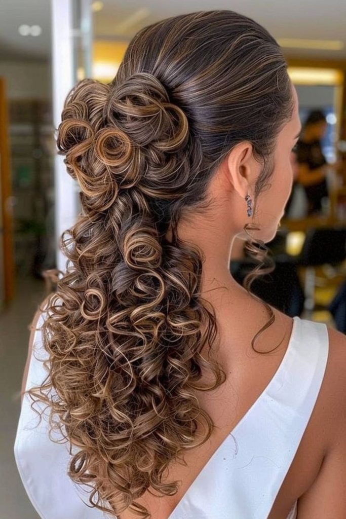 Floral inspired formal curly updo.