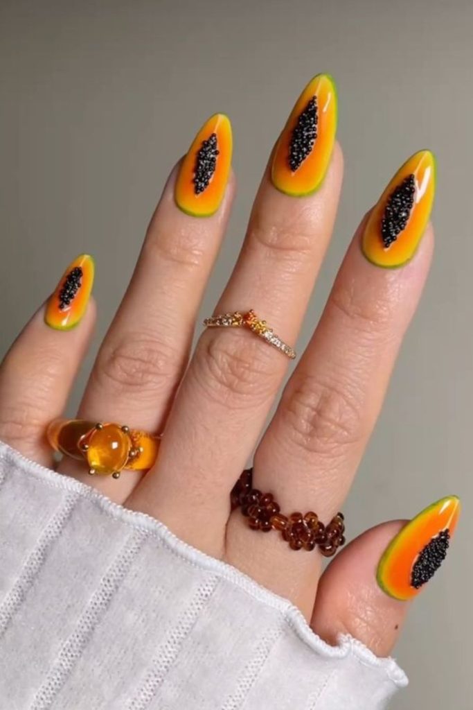 Papaya inspired tropical nail art.