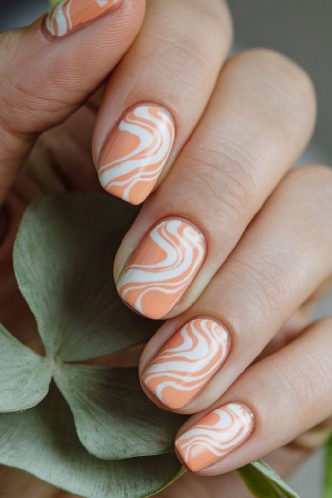 Coral swirl wave peach ocean nails