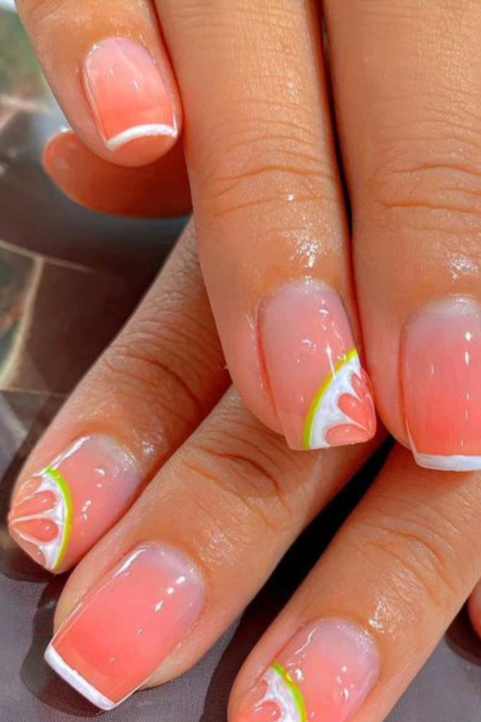 Peach slice ombré nail design.