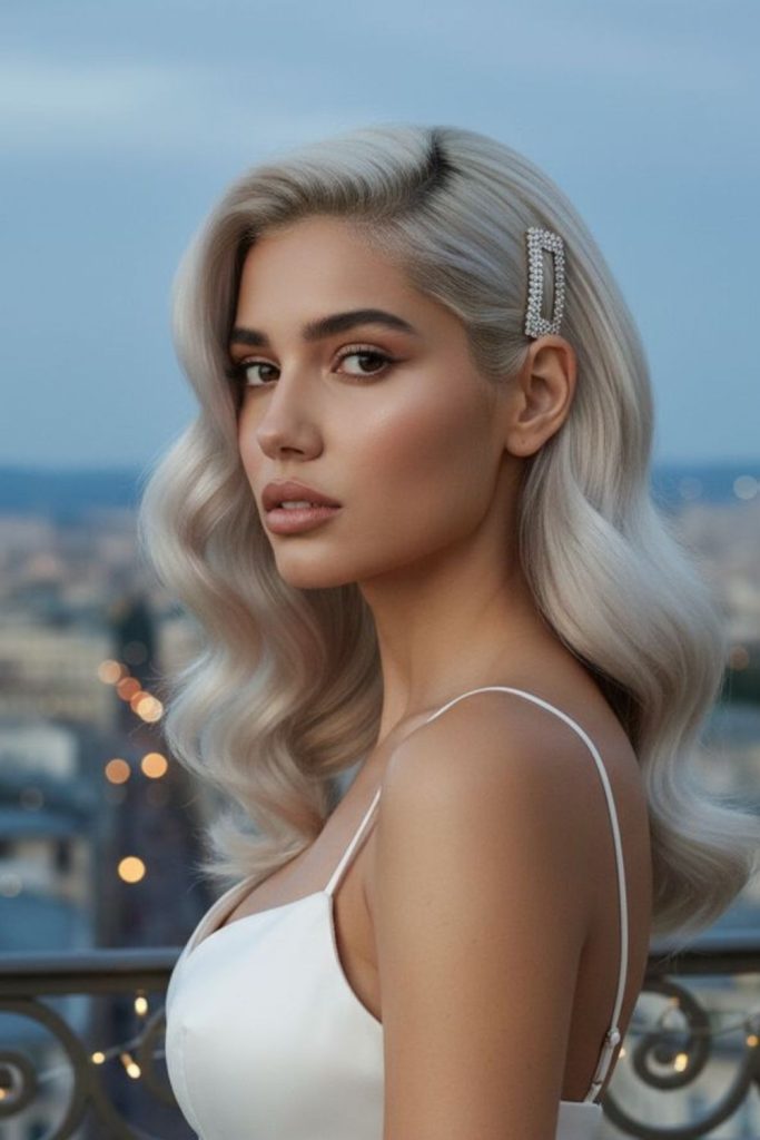 Icy platinum swoop hairstyle with sharp sleek futuristic side flow