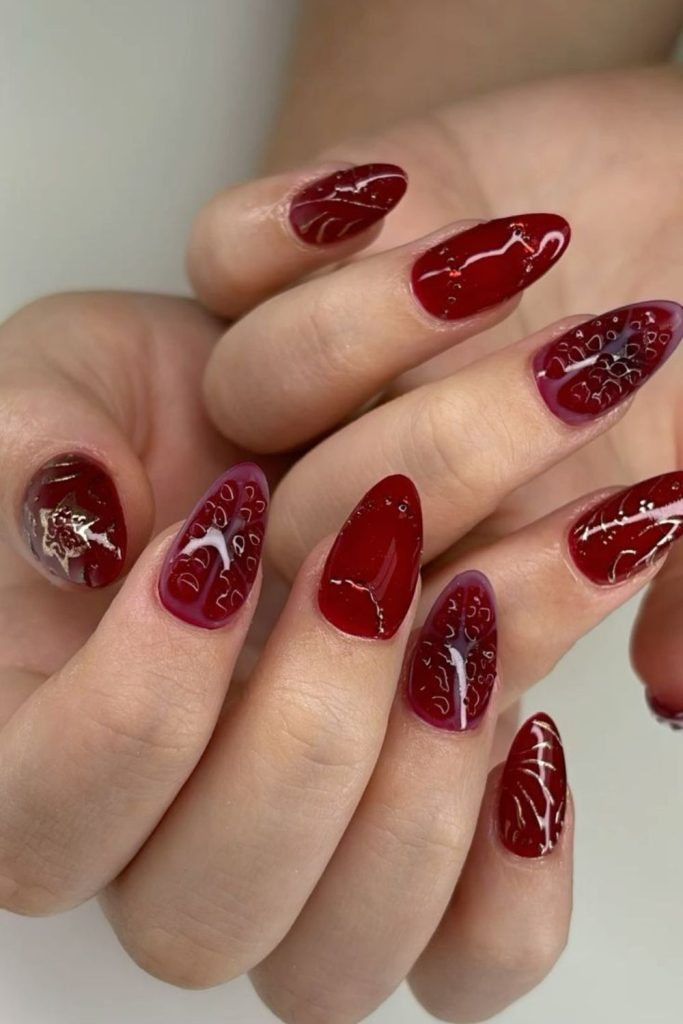 Pomegranate seed detailed glossy nails.