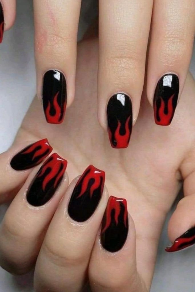 Ruby flame outline tips black nails