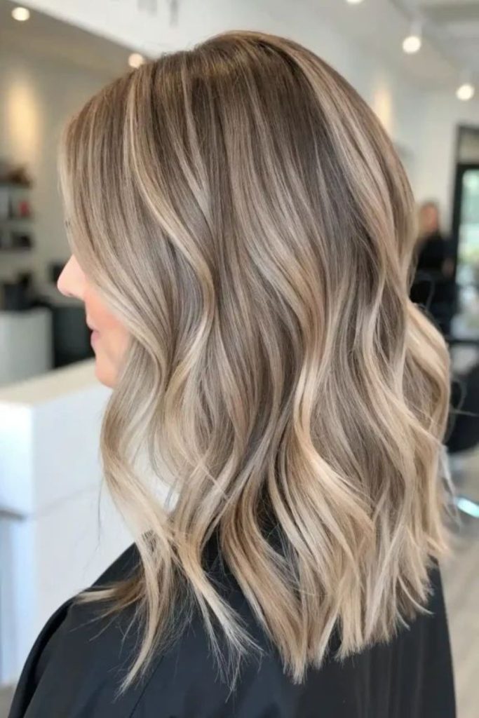 Sandy blonde highlights across brown strands.
