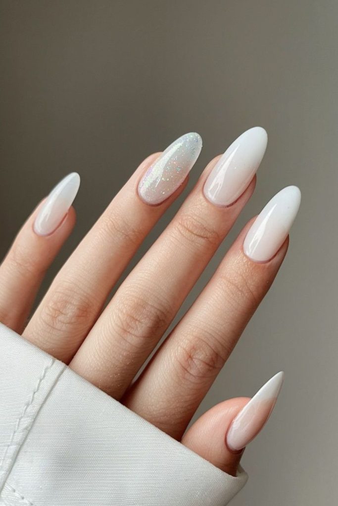 Milky white glossy graduation nails.