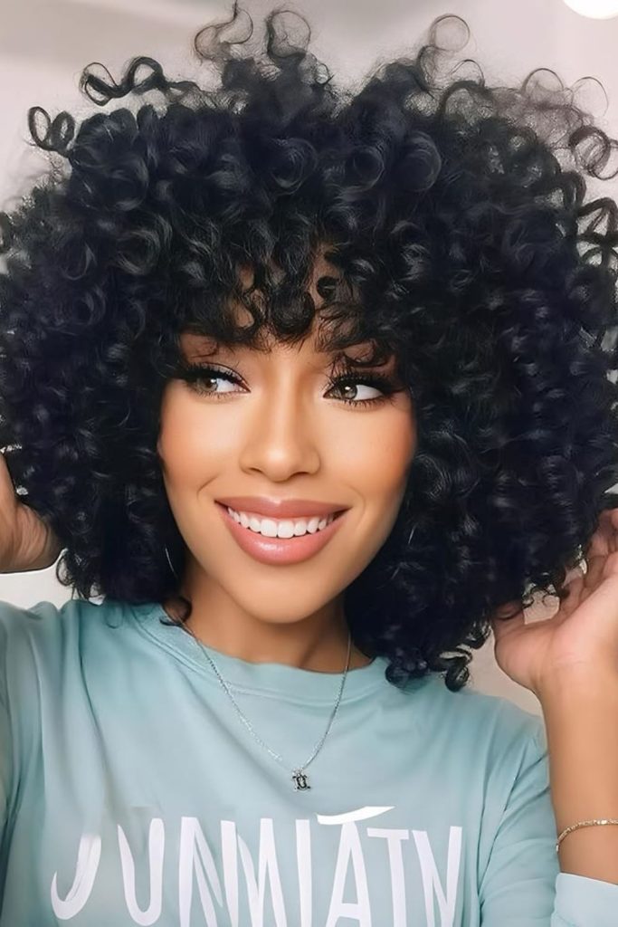 Short afro curls natural dense rounded hairstyle
