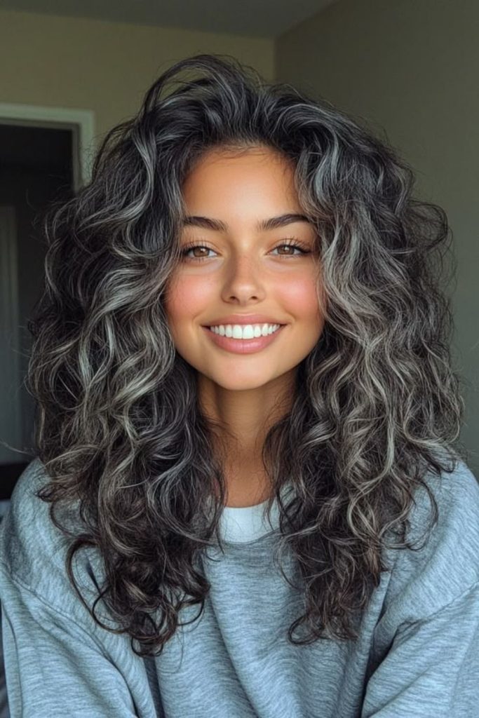 Silver misty curls streaming downward with cool shine