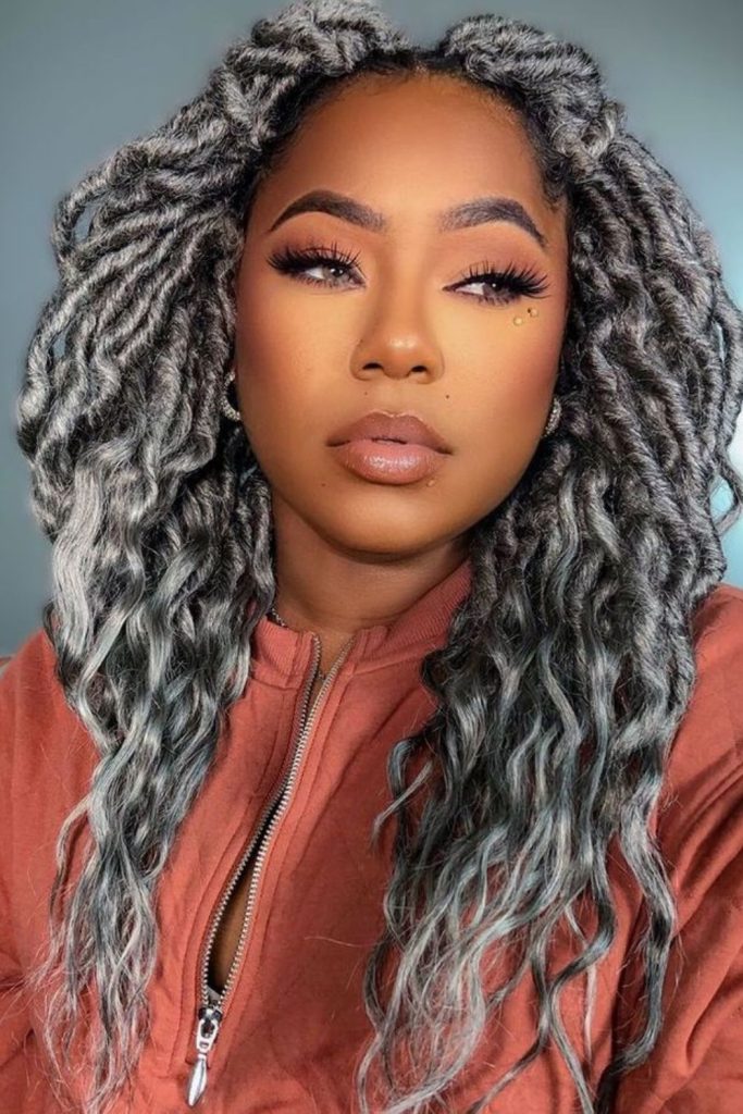 Silver highlight crochet curls contrast look.