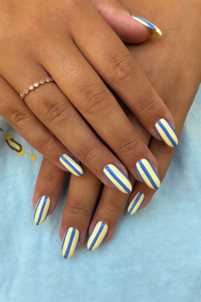 Blue nails with yellow sailor stripe design.