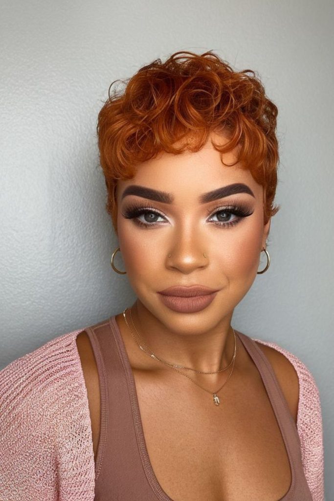 Red golden pixie hairstyle with warm gradient tones and soft layered motion.