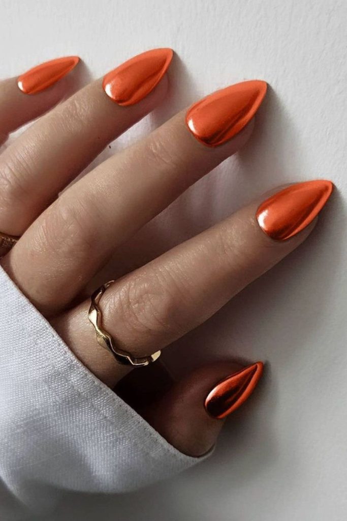 Burst bright orange sunset chrome nails