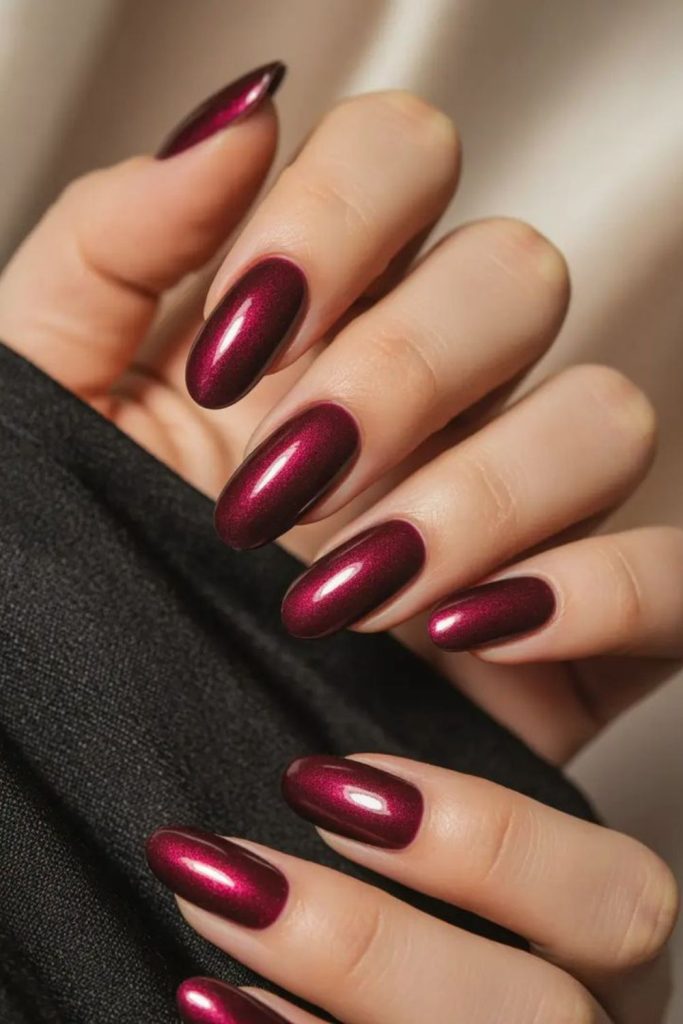 Velvet wine dramatic pointed nails.