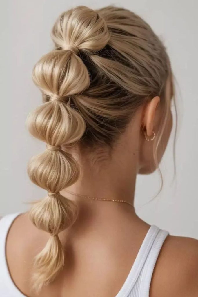 Segmented bubble pony playful sporty hairstyle look