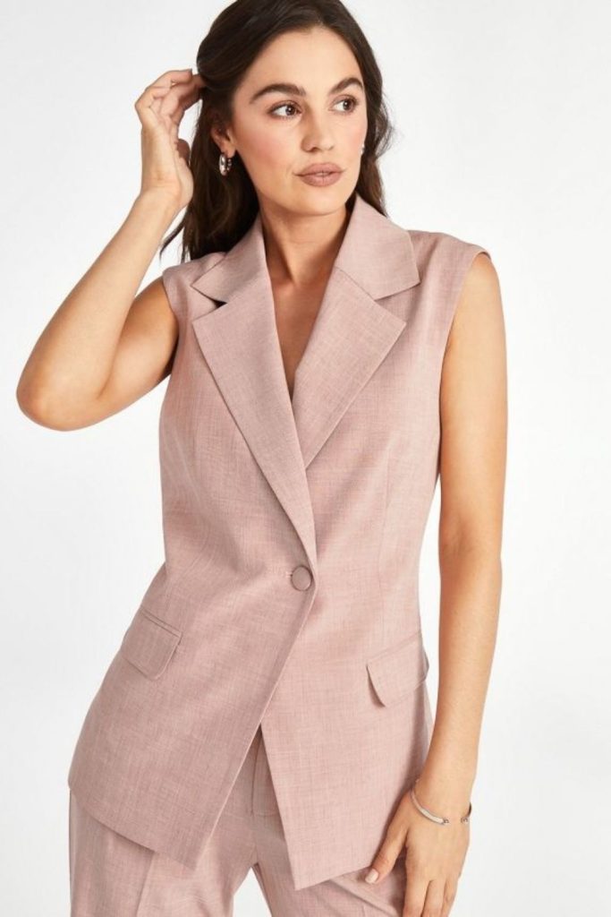 Blush sleeveless blazer polished workwear style.