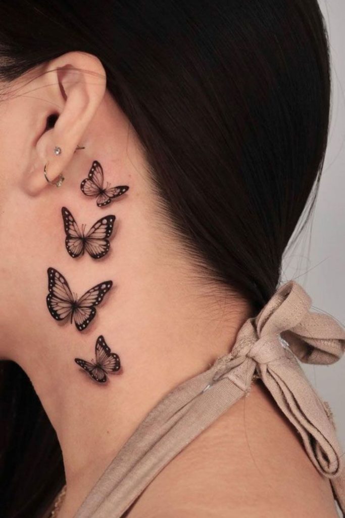 Butterfly trail hairline tattoo delicate movement.