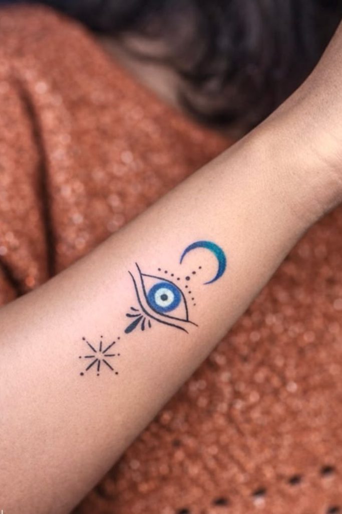 Tiny celestial eye mystical tattoo art.