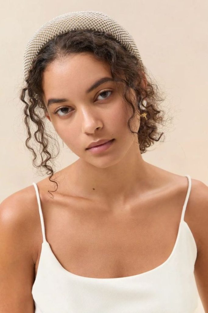 Padded headband with voluminous elegant updo.