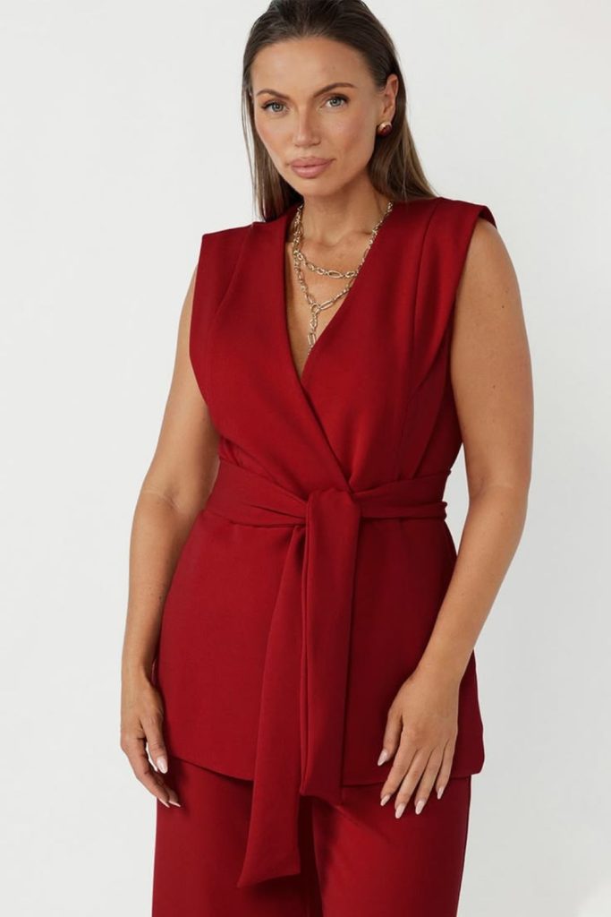 Crimson sleeveless blazer vibrant stylish appearance